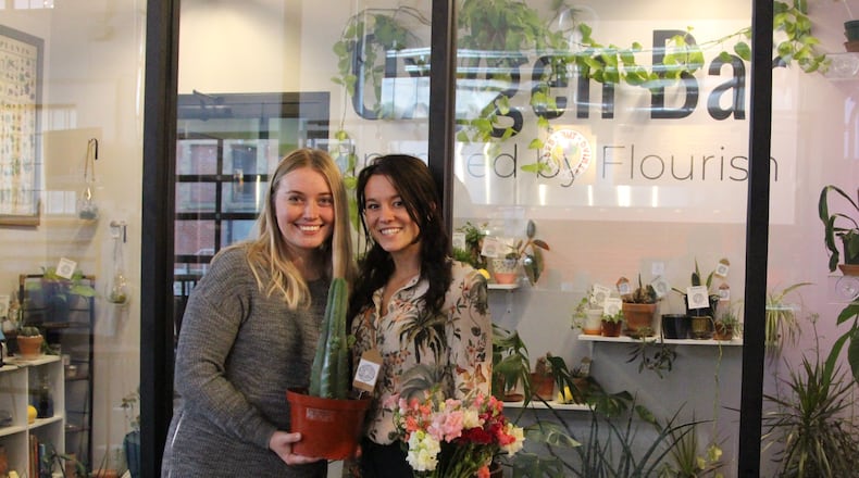 Audrey Vanzant and Rebekah Colletti stand outside the Oxygen Bar, a greenspace located at COhatch. The Oxygen Bar is an extension of their flower business Flourish. Hasan Karim/ Staff