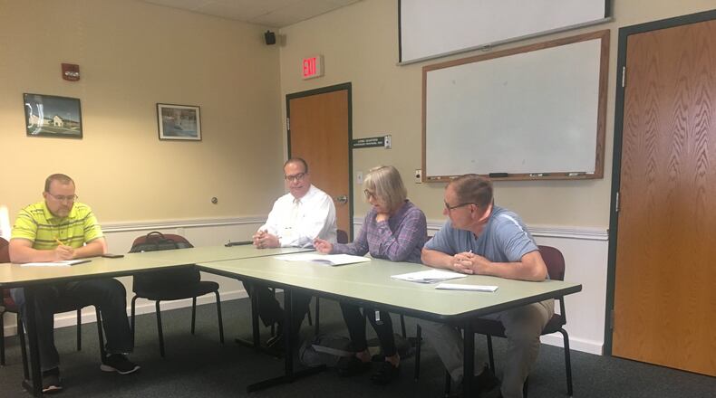 Mad River Twp. Trustees voted to hire 12 new employees and give everyone raises Friday during a special meeting at the Mad River Twp. Fire and EMS station.