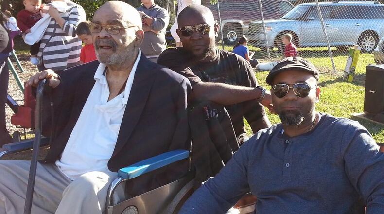 Kalen Howell Sr., right, was inspired by his late dad Charles (Tim) Howell Jr., left, and the stories of other families in the Black community in Champaign County to launch the first Black Heritage Festival in Urbana on Saturday in Barbara Howell Park, named for Charles' mom. Pictured in the middle is Kalen's brother, Jeren Howell Sr.