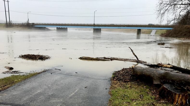 The bike path along the Great Miami River in Middletown is flooded Friday after all the recent rains. NICK GRAHAM/STAFF