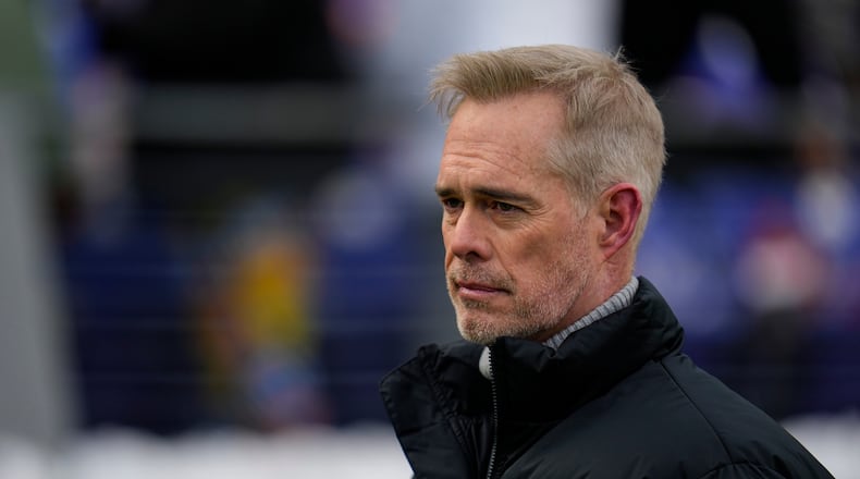 FILE - ESPN broadcaster Joe Buck walks the field before an NFL football AFC divisional playoff game between the Baltimore Ravens and the Houston Texans, Jan. 20, 2024, in Baltimore. (AP Photo/Julio Cortez, File)