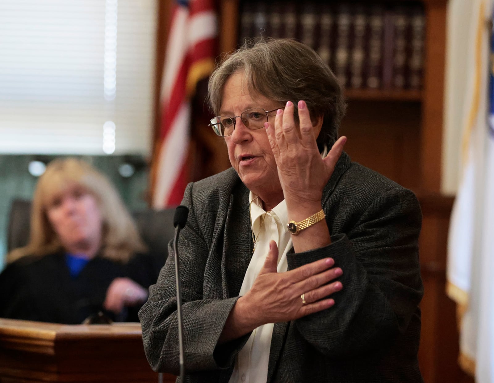 Forensic pathologist Dr. Marie Russell testifies about the type of injuries to the back of someone's arm during the murder retrial of Karen Read in Norfolk Superior Court, Monday June 2, 2025, in Dedham, Mass. (Pat Greenhouse/The Boston Globe via AP, Pool)