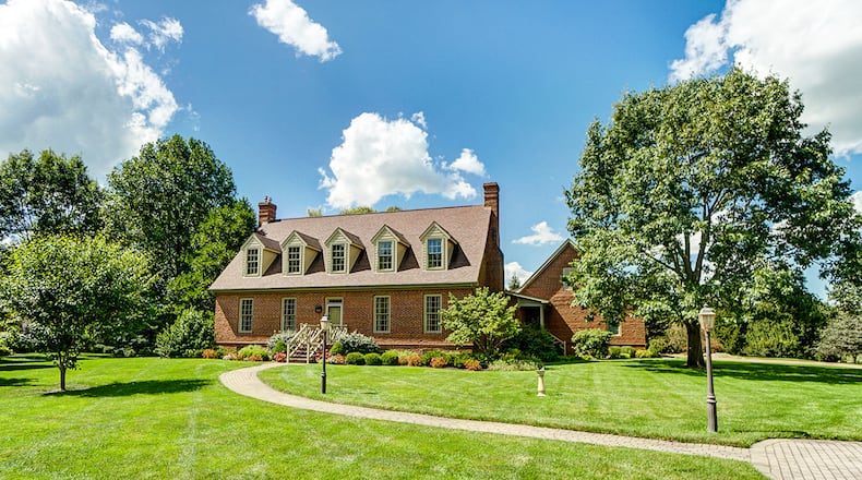 The 4-bedroom, brick, Cape Cod-style home has about 3,030 sq. ft. of living space with a partially finished basement with rec room and bath. The home on 1.13 acres includes an attached, side-entry garage. CONTRIBUTED PHOTO