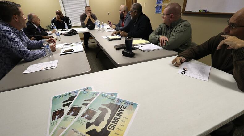 A diverse group of area pastors and other influential Christian leaders meet to discuss the upcoming “Simunye”, a racial reconciliation event at Southgate Baptist Church Wednesday. BILL LACKEY/STAFF