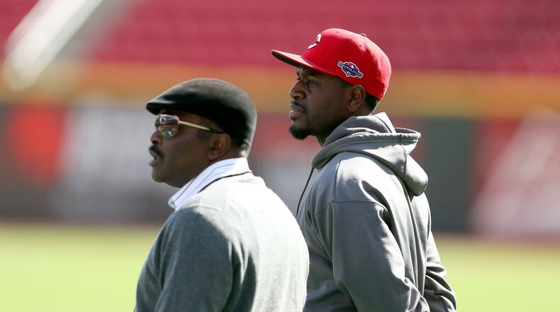 Former Reds second basemen Joe Morgan (left) and Brandon Phillips watch batting practice before Game Four of the National League Division Series against the Giants at Great American Ball Park on October 10, 2012 in Cincinnati.