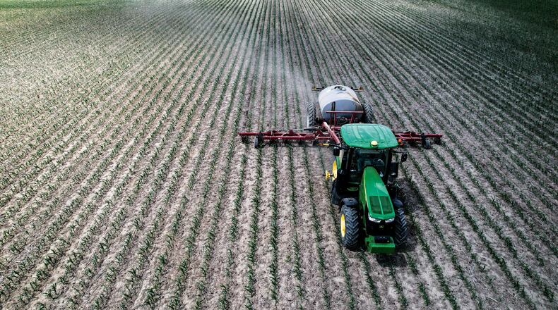 Tom Sears of Farmersville applies nitrogen on his corn crop near Hemple Road May 31, 2023. Sears has been farming in western Montgomery County for nearly 50 years. JIM NOELKER/STAFF