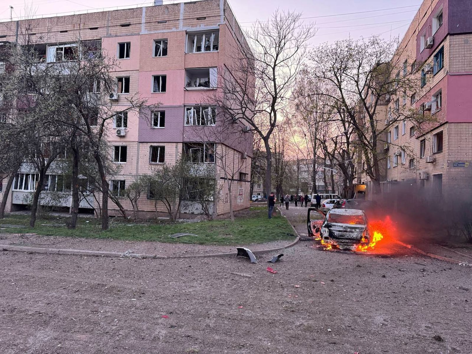 In this photo provided by the Ukrainian Emergency Service, a car burns following Russia's missile attack that killed 14 civilians including six children in Kryvyi Rih, Ukraine, Friday, April 4, 2025. (Ukrainian Emergency Service via AP)