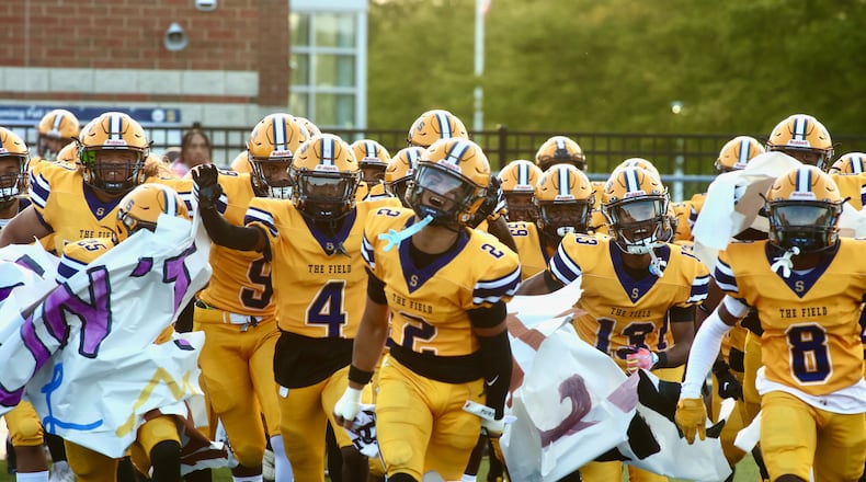 Springfield takes the field before a game against Winton Woods on Friday, Aug. 23, 2024, in Springfield. The Wildcats defeated Miamisburg on Friday in their GWOC opener. David Jablonski/Staff