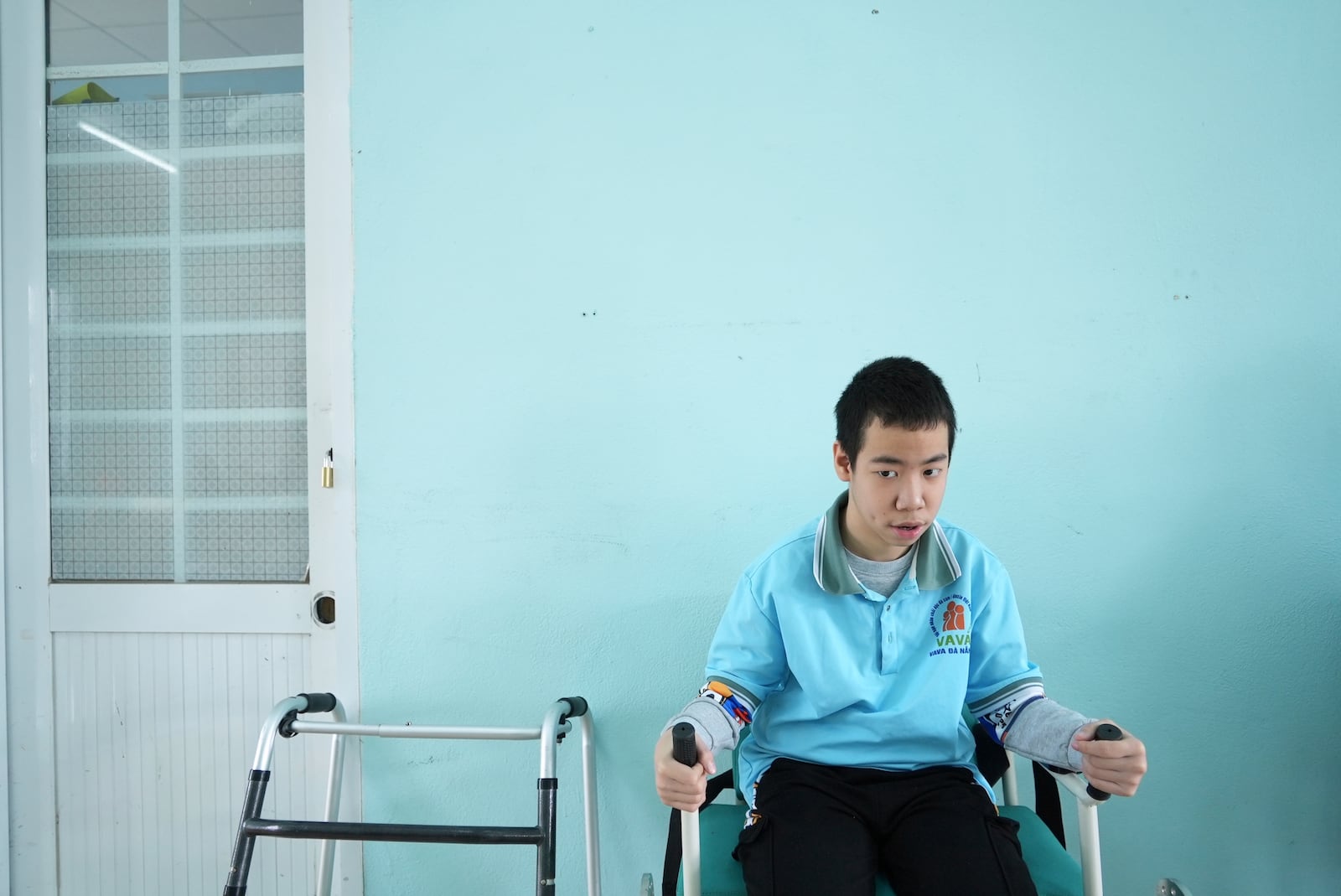 Nguyen Ba Quy Phuoc, 14, attends a physiotherapy class at a school for victims of Agent Orange in Da Nang, Vietnam, March 7, 2025. (AP Photo/Hau Dinh)