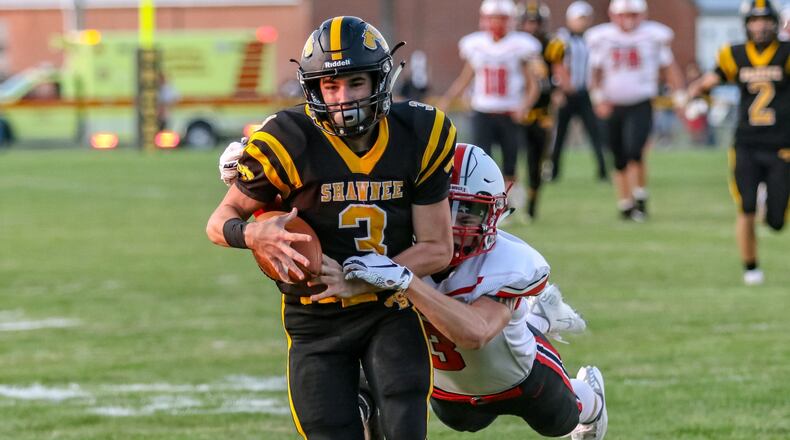 Shawnee’s Wes Schuler is tackled by Tippecanoe’s Troy Taylor after catching a pass during their game on Thursday night in Springfield. The Braves won 42-24. CONTRIBUTED PHOTO BY MICHAEL COOPER