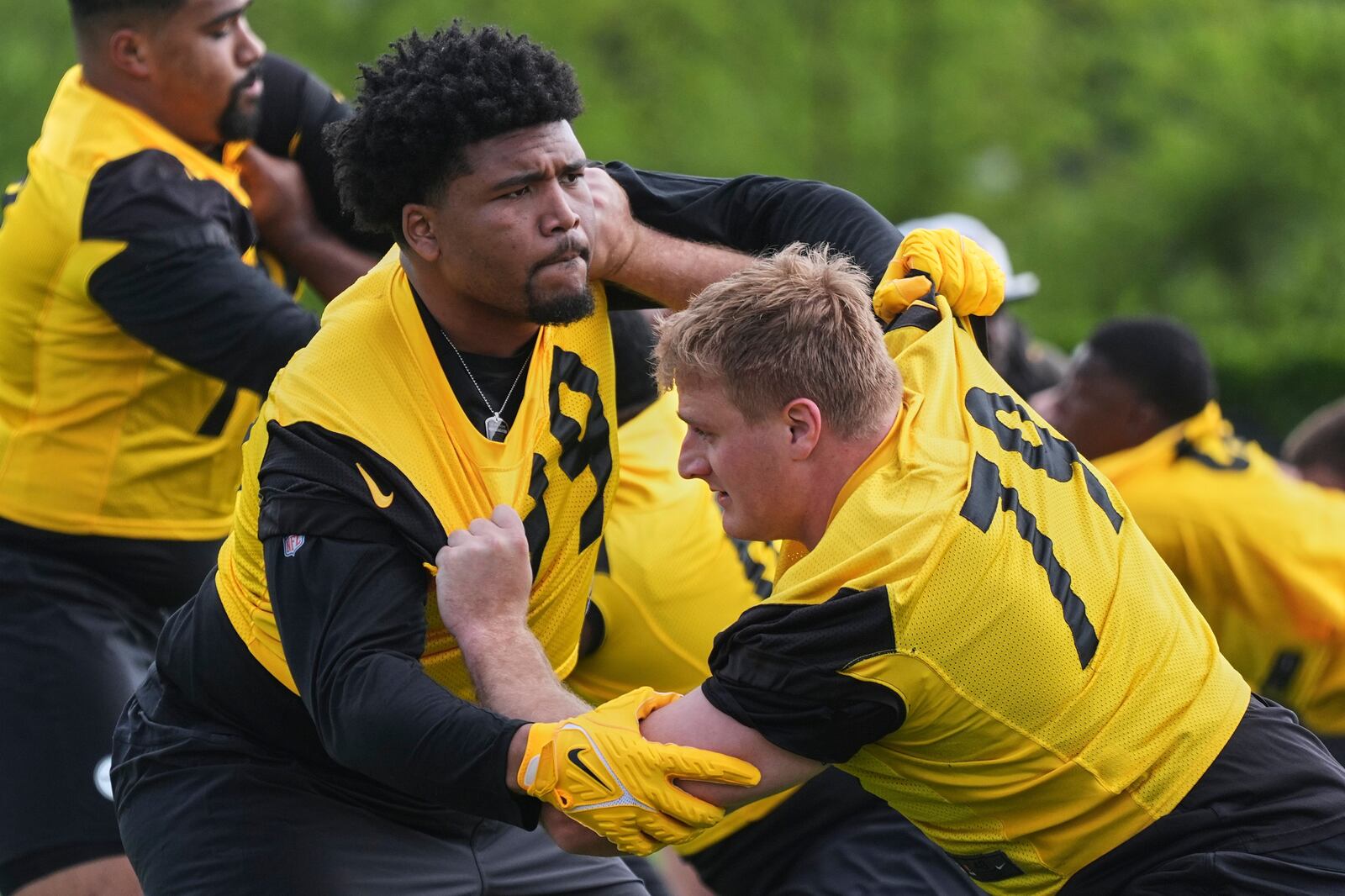Pittsburgh Steelers first round draft pick Derrick Harmon, left, works against veteran Jacob Slade (79) during the during the NFL football team's rookie camp in Pittsburgh, Friday, May 9, 2025. (AP Photo/Gene J. Puskar)