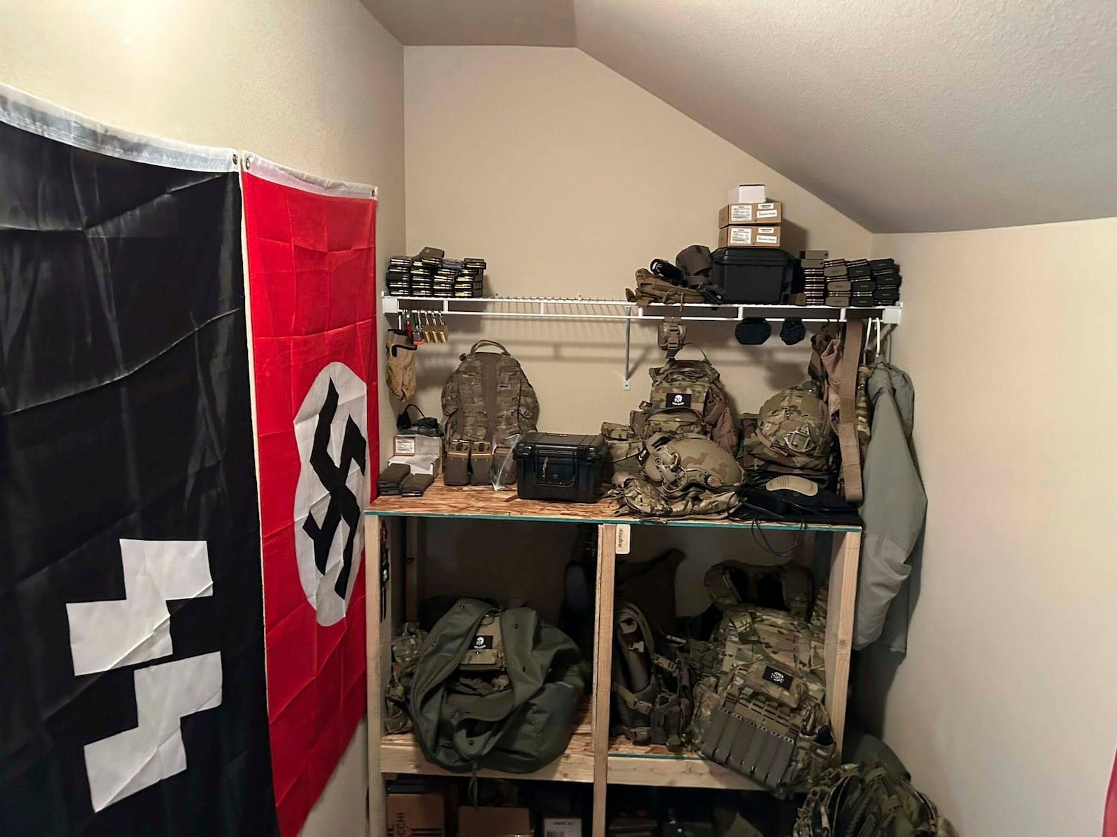 In this undated photo released by the Thurston County Sheriff's Office, a cache of military weaponry and Nazi paraphernalia are photographed during a raid at a home in Lacey, Wash. (Thurston County Sheriff's Office via AP)