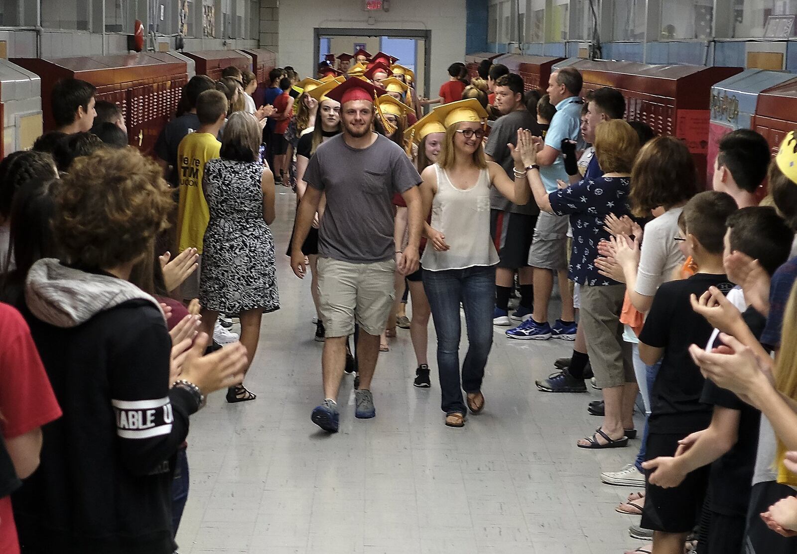 The graduating seniors from Northeastern High School got a chance to see where it all began for most of them 12 years ago as they marched through South Vienna School Friday with their graduation caps on. Bill Lackey/Staff