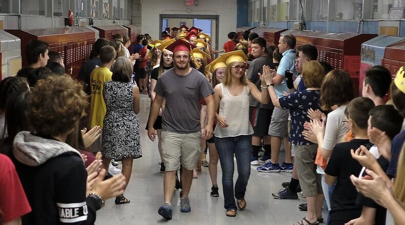 The graduating seniors from Northeastern High School marched through South Vienna School a few years ago with their graduation caps on. Bill Lackey/Staff