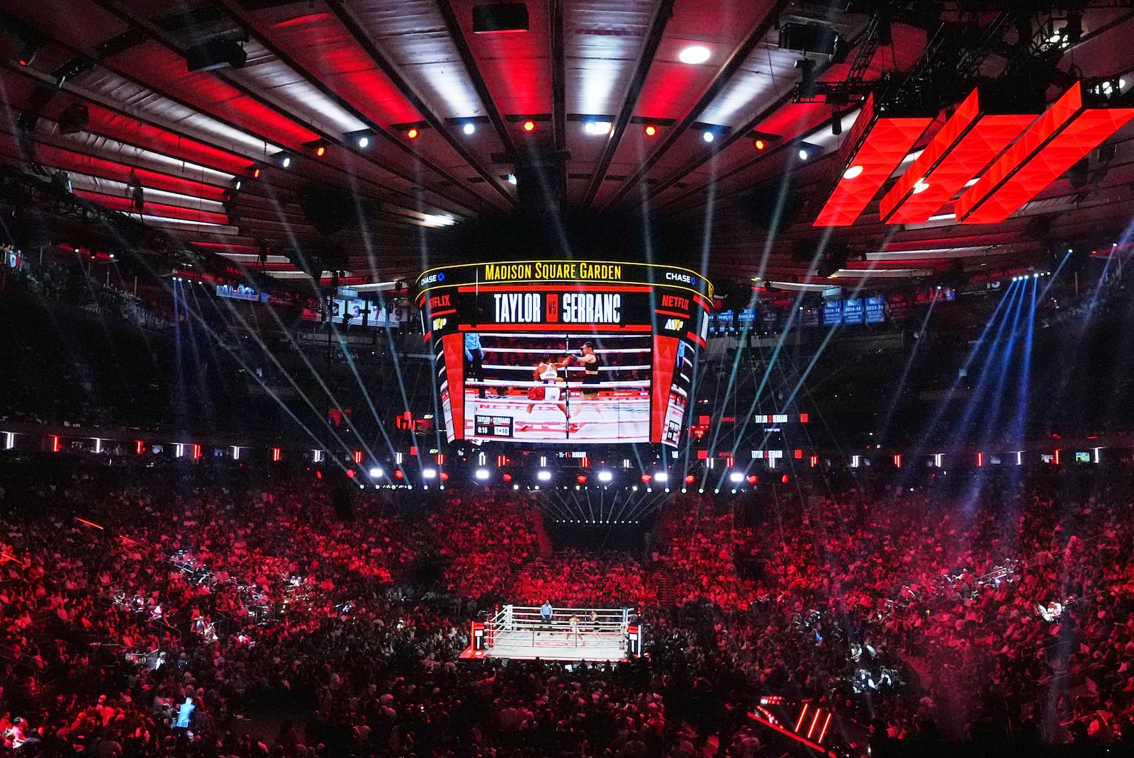 Fans watch Puerto Rico's Amanda Serrano fight Ireland's Katie Taylor during the first round of a super lightweight championship boxing match Friday, July 11, 2025, in New York. (AP Photo/Frank Franklin II)