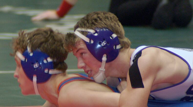 Mechanicsburg’s Tyler Wetzel looks to turn Edison’s Trent Warner during his 18-6 win at 126 during the semifinals of the OHSAA state team tournament Sunday at St. John Arena. John Cummings/Contributed photo