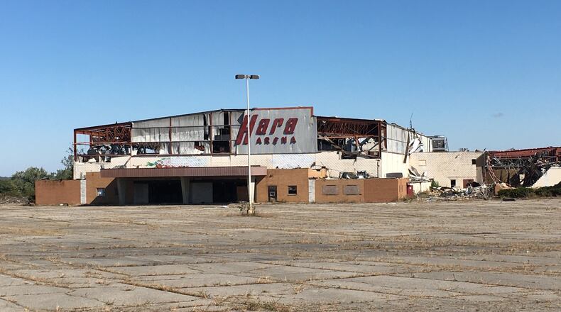 Hara Arena remained in ruins Monday, Oct. 14, more than four months after it was heavily damaged in the Memorial Day tornadoes. Property owners say a rezoning is needed before they can begin cleanup and redevelopment.