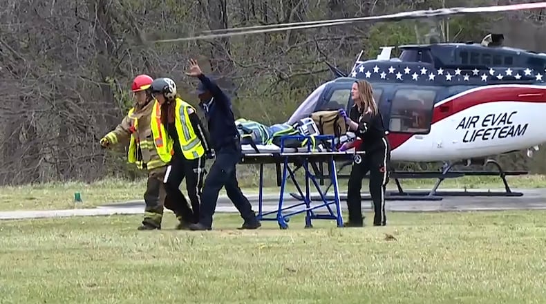 This image taken from video shows emergency responders at the scene of a fatal school bus crash on Friday, March 27, 2026, in Carroll County, Tennessee. (WBBJ-TV via AP)