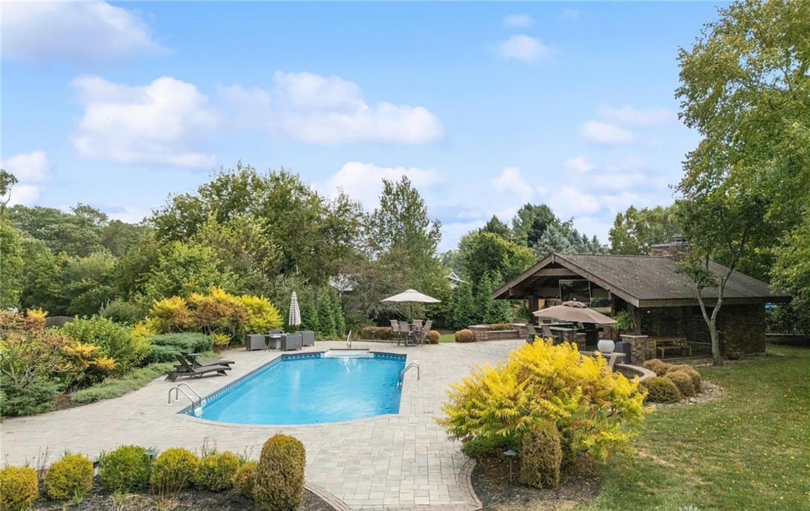 The inground pool area also has a pavilion with outdoor woodburning fireplace and grilling area. CONTRIBUTED