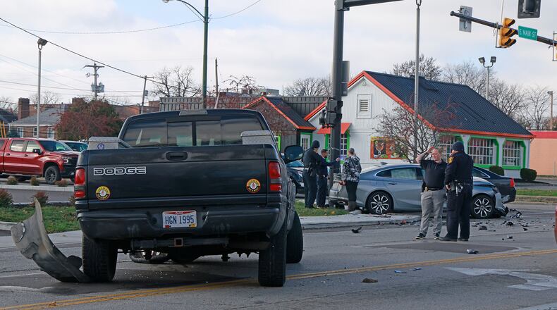 Police investigate the scene of a multi car crash at the intersection of Belmont Avenue and East Main Street on Tuesday, Nov. 26, 2024. BILL LACKEY/STAFF