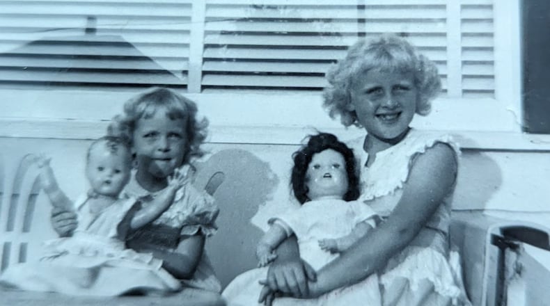 Carole Laycock of Fairfield (right) and her sister, Jane, with dolls in 1949.