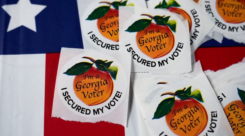 FILE - Stickers lay on a table inside a polling place, Nov. 5, 2024, in Atlanta. (AP Photo/Brynn Anderson, File)
