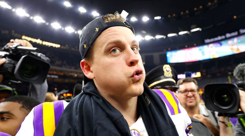 NEW ORLEANS, LOUISIANA - JANUARY 13: Joe Burrow #9 of the LSU Tigers celebrates after defeating the Clemson Tigers 42-25 in the College Football Playoff National Championship game at Mercedes Benz Superdome on January 13, 2020 in New Orleans, Louisiana. (Photo by Kevin C. Cox/Getty Images)