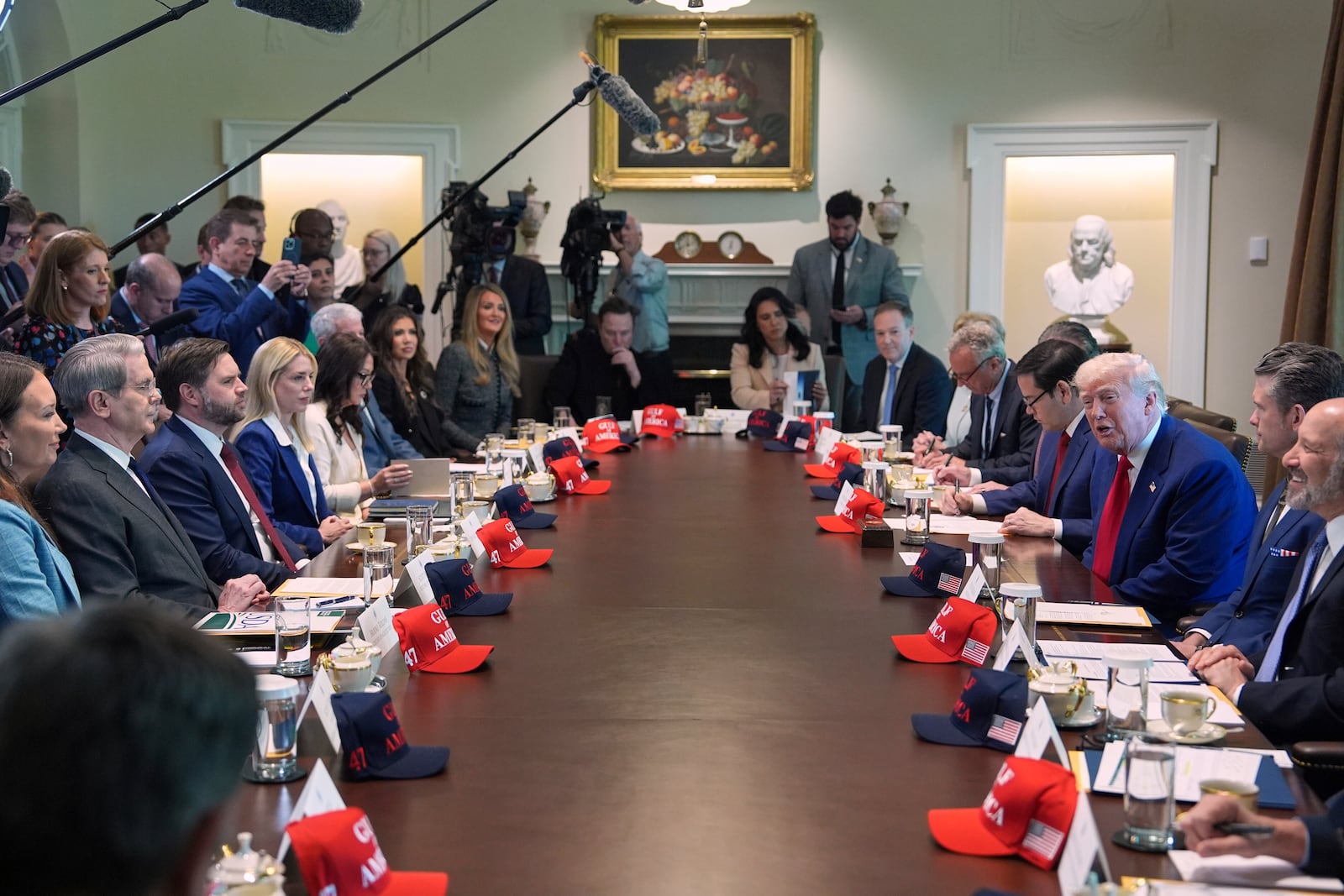 President Donald Trump, right, speaks during a cabinet meeting at the White House, Wednesday, April 30, 2025, in Washington. (AP Photo/Evan Vucci)