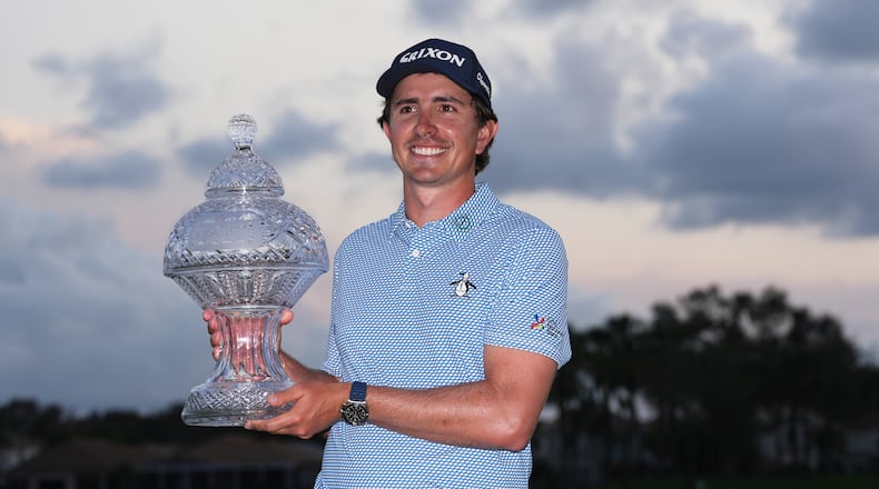 Nico Echavarria of Colombia holds the Cognizant Classic Trophy at the end of the final round of the Cognizant Classic golf tournament, Sunday, March 1, 2026, in Palm Beach Gardens, Fla. (AP Photo/Marta Lavandier)