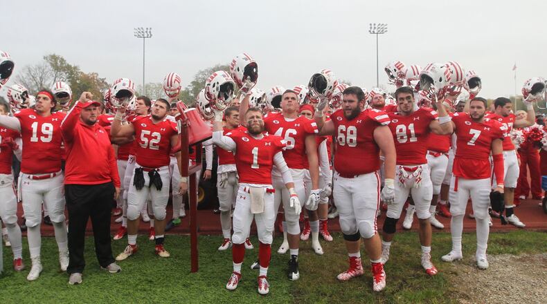 Wittenberg players sing the fight song after a victory against Ohio Wesleyan on Saturday, Nov. 4, 2017, at Edwards-Maurer Field in Springfield. David Jablonski/Staff