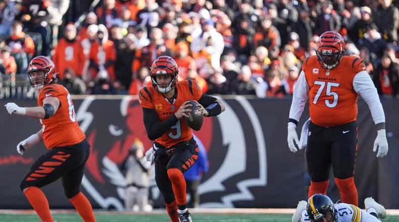 Cincinnati Bengals quarterback Joe Burrow (9) runs with the ball during the first half of an NFL football game against the Pittsburgh Steelers, Sunday, Dec. 1, 2024, in Cincinnati. (AP Photo/Joshua A. Bickel)