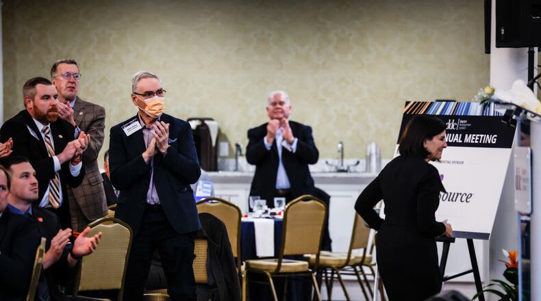 The audience applauds as Deborah Feldman, president and CEO of Dayton Children's Hospital, heads to the podium to accept the Maureen Patterson Regional Leader Award the Dayton Development Coalition annual meeting held at Carillon Historical Park Wednesday Feb. 2, 2022. The coalition meeting attracted around 500 community and business leaders. The coalition said many of the investments in the Dayton region were by companies new to the area, helping further diversify the economy. JIM NOELKER/STAFF