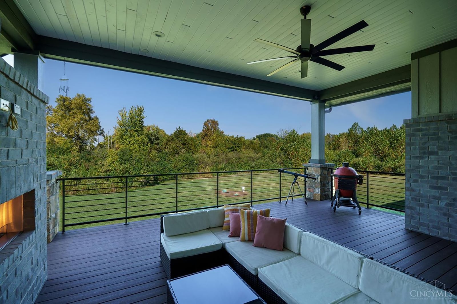The composite deck is off the main level and is covered with a ceiling fan and double sided gas fireplace. CONTRIBUTED