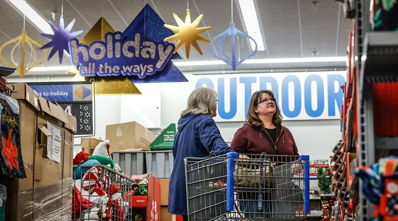 Sherry Gregory, left and Kari Knight shop together at the Beavercreek Walmart Monday November 14, 2022.  JIM NOELKER/STAFF