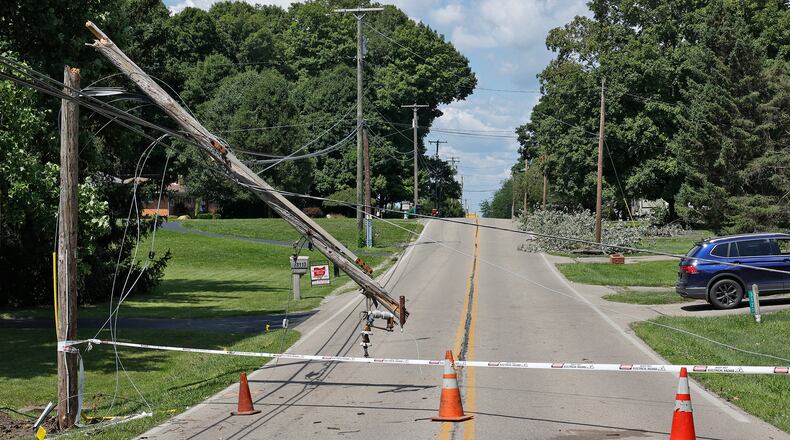 Leffel Lane is still closed Monday, July 31, 2023 due to a broken utility pole that fell during Saturday's early morning storm. The road is closed from East Possum Road to Cheviot Hills Drive. BILL LACKEY/STAFF
