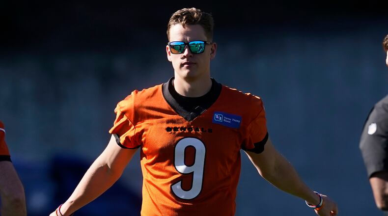 Cincinnati Bengals quarterback Joe Burrow (9) stretches during a walk through in an NFL football practice Saturday, Feb. 12, 2022, in Los Angeles. The Cincinnati Bengals play the Los Angeles Rams in the Super Bowl Sunday Feb. 13. (AP Photo/Marcio Jose Sanchez)