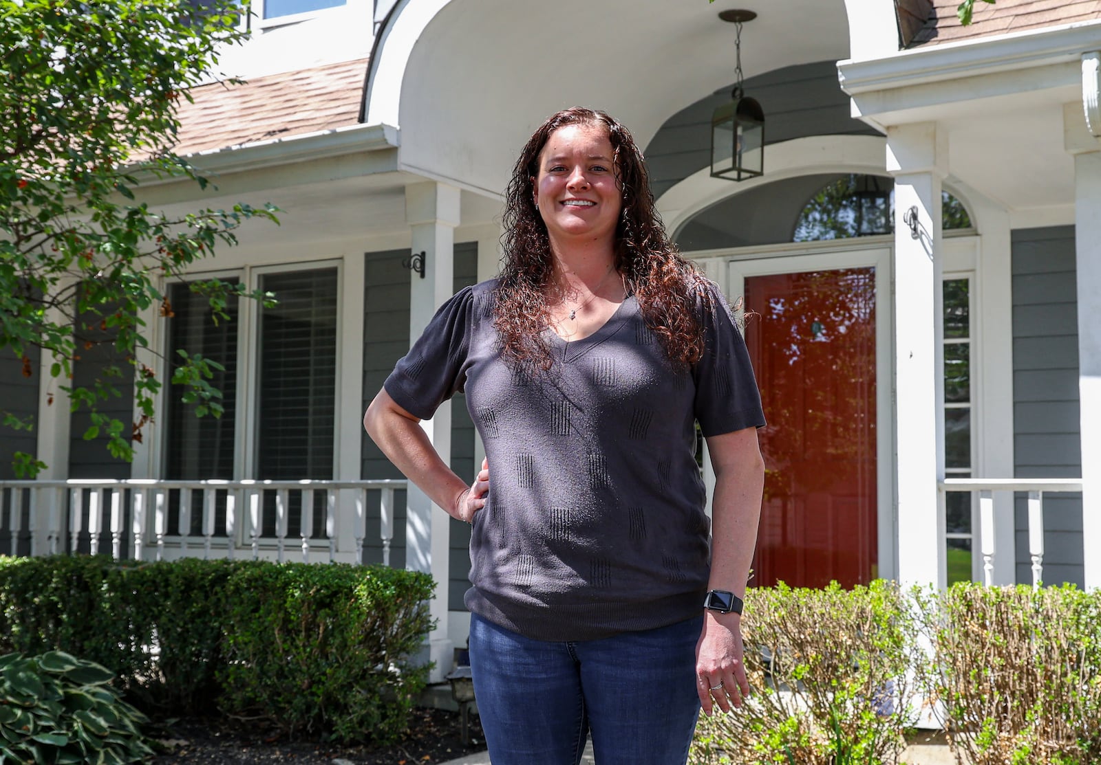 Kathyn Tolbert poses in front of her home in western Troy on Wednesday, Sept. 3. She recently purchased the property and moved from Butler Township. Ohio’s real estate market emerged as one of the most dynamic in the country during the first half of 2025. The state recorded the second most substantial property value changes nationwide with home prices rising by 18% from January to June. BRYANT BILLING / STAFF