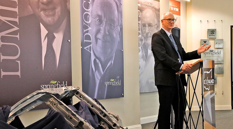 Brad Pepper, vice president of Topre America, talks about the new $10 million facility his company plans to build in the Champion Business Park in Springfield and the Honda front end, in foreground, that they intend to build there. Bill Lackey/Staff