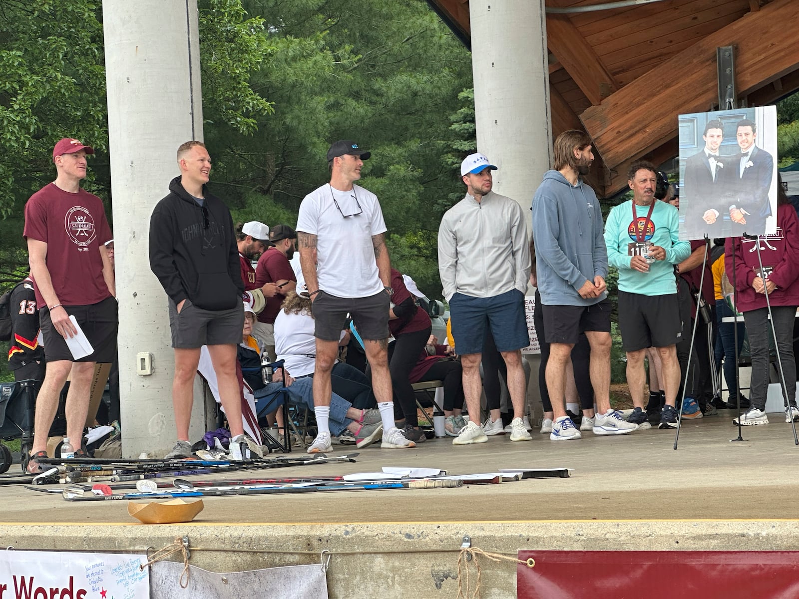 Hockey players, from left, Buddy Robinson, Brady Tkachuk, Erik Gudbranson, Tony DeAngelo and Zach Aston-Reese along with Guy Gaudreau, father of hockey players Johnny and Matthew Gaudreau who were fatally struck by a motorist while riding bicycles, attend the inaugural Gaudreau Family 5K Walk, Run and Family Day, Saturday, May 31, 2025, in Sewell, N.J. (AP Photo/Stephen Whyno)