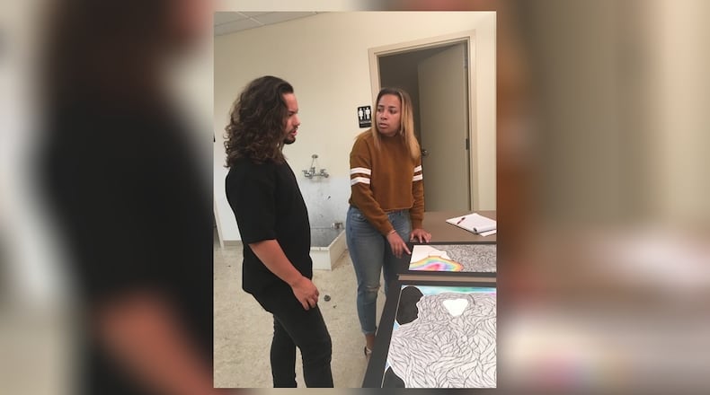 Ryan A. Ramirez, a 2017 Springfield High graduate, and Jasmine Owens, a current student at Springfield High, go over plans for the upcoming Vanity Deficit exhibit at the Springfield Museum of Art. Ramirez is the guest curator for the event, which showcases the work of young artists. CONTRIBUTED