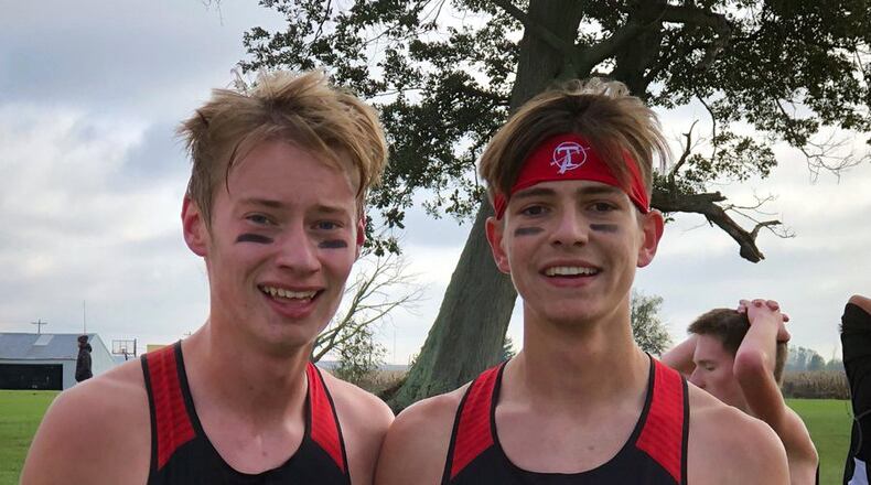 Tecumseh seniors and best friends Garrett Gemmaka (left) and Ethan Adams (right) compete in the Division I cross country regional championships Saturday in Troy. Contributed