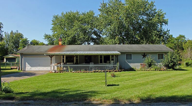 This 3-bedroom ranch home with about 1,300 sq. ft. of living space sits on .58 acres. It has an attached, 2-car garage. CONTRIBUTED PHOTO BY VICKIE KAPNAS