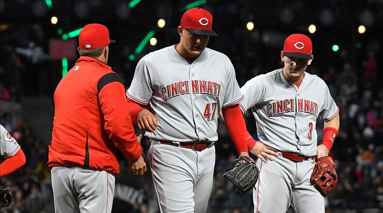 SAN FRANCISCO, CA - MAY 14: Interim manager Jim Riggleman #35 of the Cincinnati Reds takes the ball from starting pitcher Sal Romano #47 taking Romano out of the game against the San Francisco Giants in the bottom of the third innng at AT&T Park on May 14, 2018 in San Francisco, California. (Photo by Thearon W. Henderson/Getty Images)