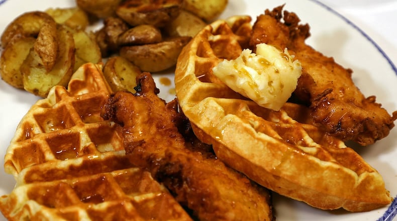 Chicken and Waffles are a popular item on the menu at Ellie’s Restaurant & Bakery. BILL LACKEY/STAFF