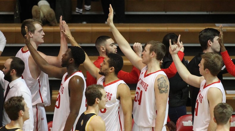 Wittenberg celebrates a victory against DePauw on Wednesday, Jan. 24, 2018, at Pam Evans Smith Arena in Springfield. David Jablonski/Staff