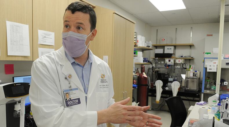 Dr. Robert Lober, at Dayton Children’s, collects brain tumor tissue and then keeps it at a living biobank. By keeping the brain tumors alive, researchers can come back again and again for a sample, trying new therapies and treatments. MARSHALL GORBY\STAFF