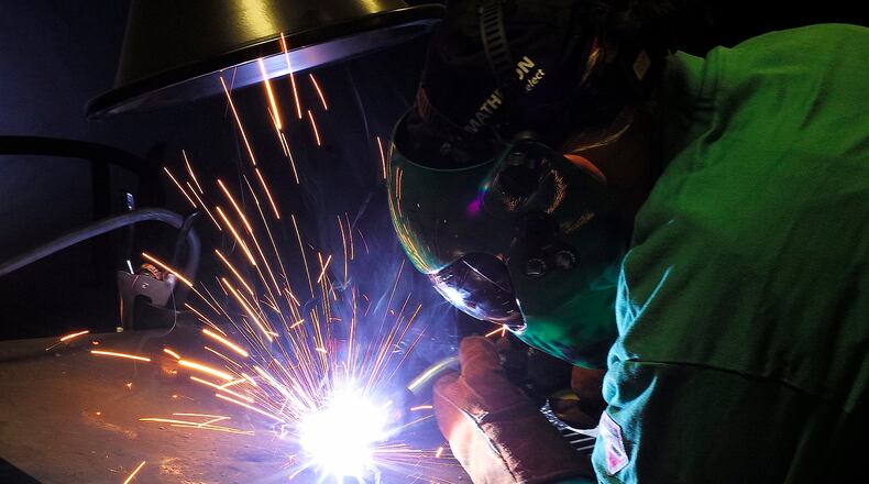 Clark and Champaign counties are joining with three other counties to survey wage and benefits at local employers in the region. Bill Lackey/Staff