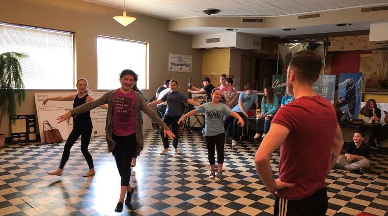 Paul Smith choreographs a scene as the Springfield Arts Council Youth Arts Ambassadors rehearse for the upcoming Junior Theater Festival in Atlanta this weekend. BRETT TURNER/CONTRIBUTOR
