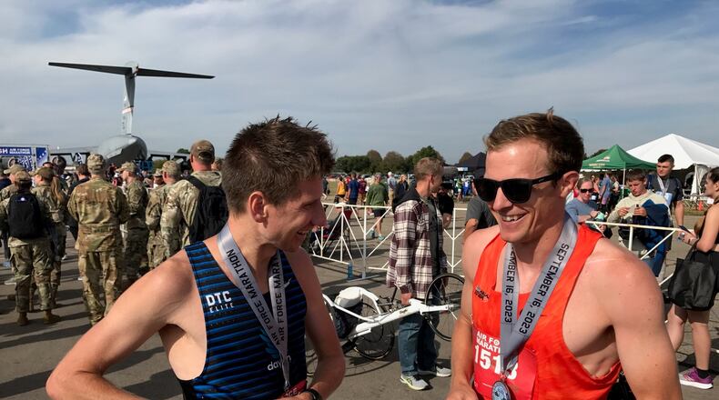 The 2023 Air Force Marathon winnner Jason Salyer (left) and runner-up Connor Roche talk after the race. They met on the course and had a side-by-side battle for much of the race.