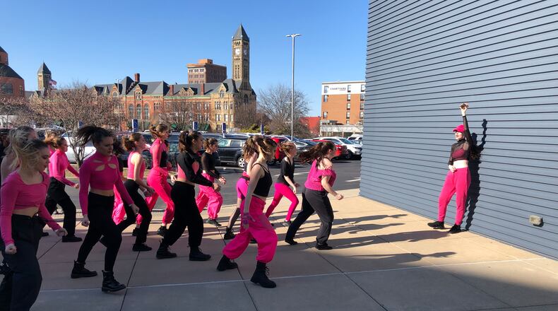 A dance team rehearses outside the Hollenbeck Bayley Creative Arts and Conference Center prior to Sunday's Dance Stomp Shake competition at the Clark State Performing Arts Center.
